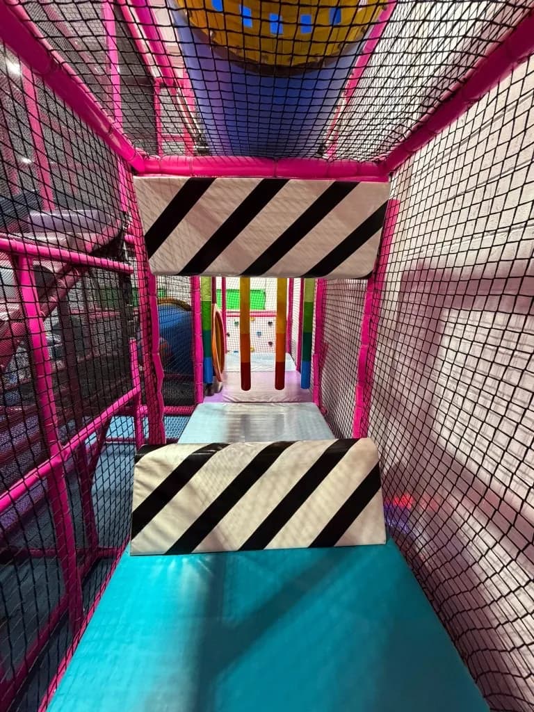 Purple padded play zone with slides at Fun Factory Play Café
