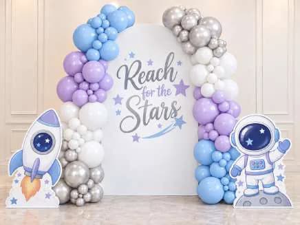 Single backdrop with two full balloon garlands and themed cutouts